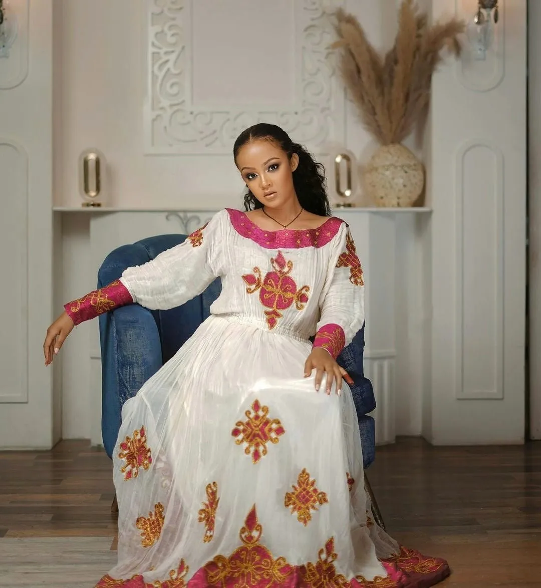 Enchanting Pink Sparkle: Modern Menen Fabric in Habesha Kemis